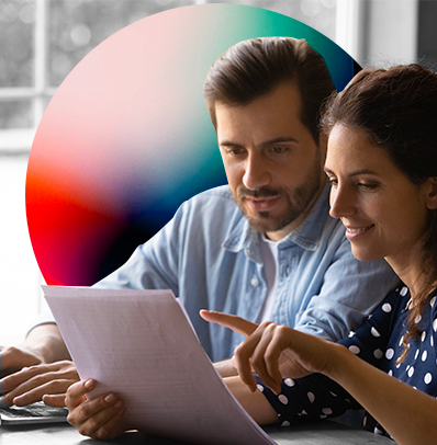 man and woman looking at report together